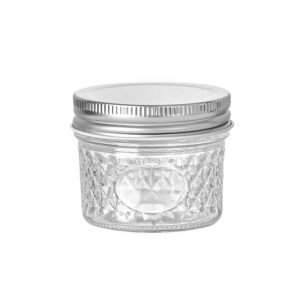 Quilted pattern 4oz regular mouth mason jar with metal lid.