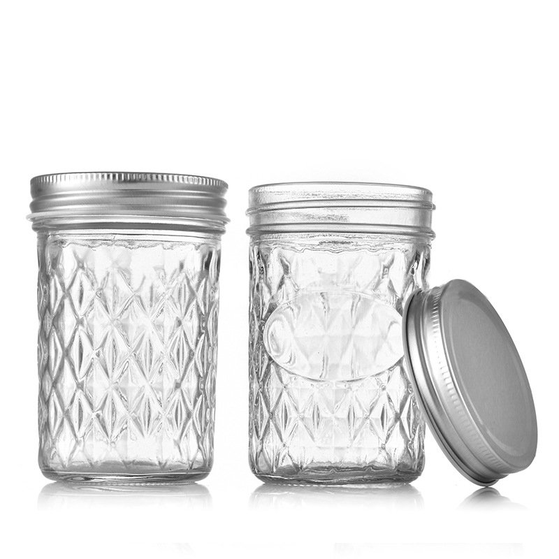 Classic quilted pattern 8oz regular mouth mason jar with metal lid.