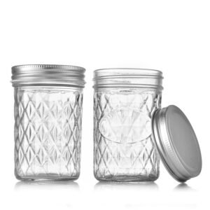 Classic quilted pattern 8oz regular mouth mason jar with metal lid.