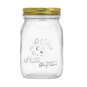Embossed 550ml glass mason jar with decorative pattern and metal lid for food storage.