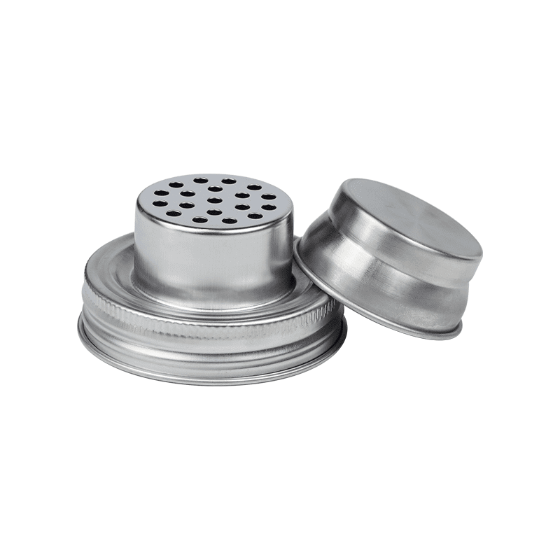 Professional mason jar cocktail shaker lid with built-in strainer, attached to a jar during use.