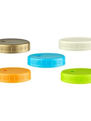 BPA-free plastic wide mouth mason jar lid with boba straw, attached to a jar filled with bubble tea.