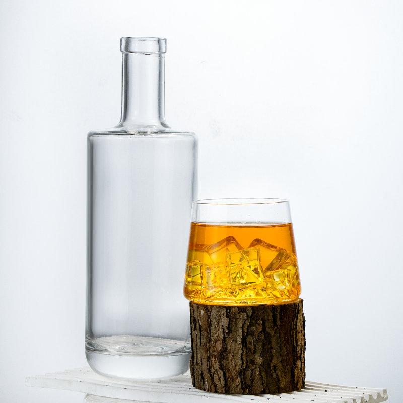 Clear 700ml glass vodka bottle with modern design and compatible closure.