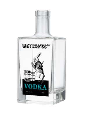 Light highlighting the exceptional clarity and color presentation of the square flint glass bottle.