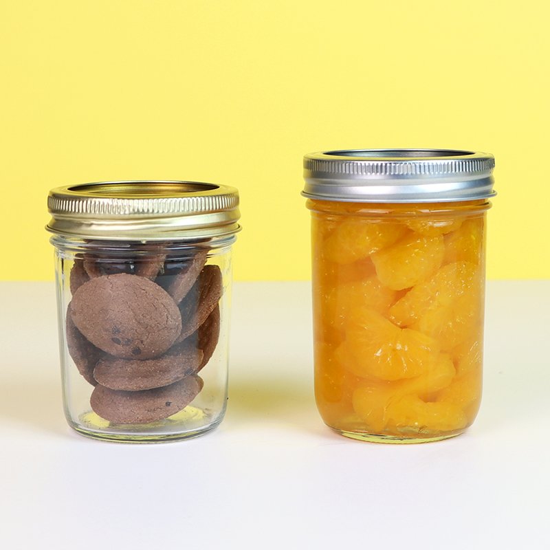 Tapered jar filled with jam and another with chocolate spread showing product visibility.