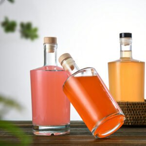 Three flat shoulder crystal flint glass bottles in 375ml, 500ml and 750ml sizes with cork closures.