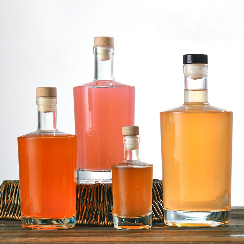 Three flat shoulder crystal flint glass bottles in 375ml, 500ml and 750ml sizes with cork closures.